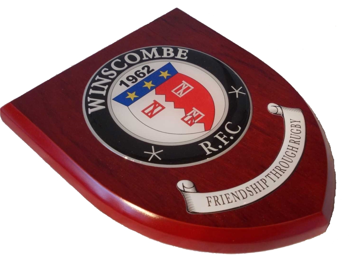 Presentation shield with medium round shaped centrepiece and scroll.